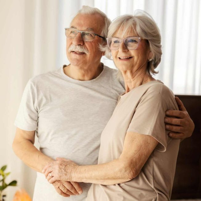 Smiling,Senior,Couple,In,Love,Hugging,At,Nursing,Home,And